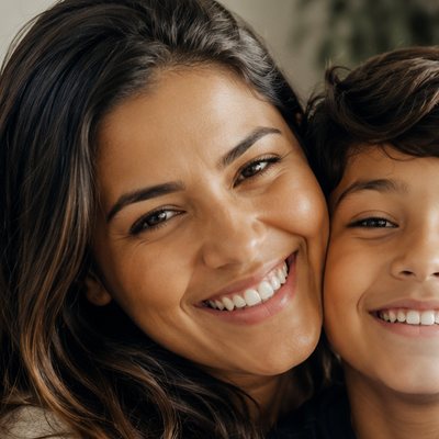 Juliana hugging her son, both smiling in their living room